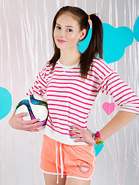CrocoPost presents: Adorable looking brunette model starts to tease us in her nice small clothing before almost taking of her bras
