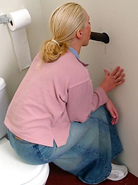 CrocoPost presents: Blonde girl Jamie sits on the toilet and blows a black gloryhole dong